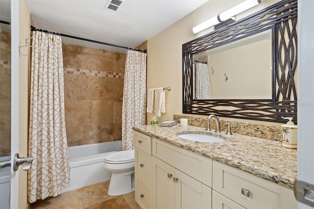 full bathroom with vanity, tile patterned flooring, toilet, and shower / tub combo