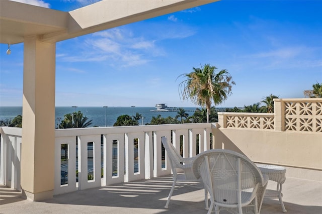 balcony featuring a water view