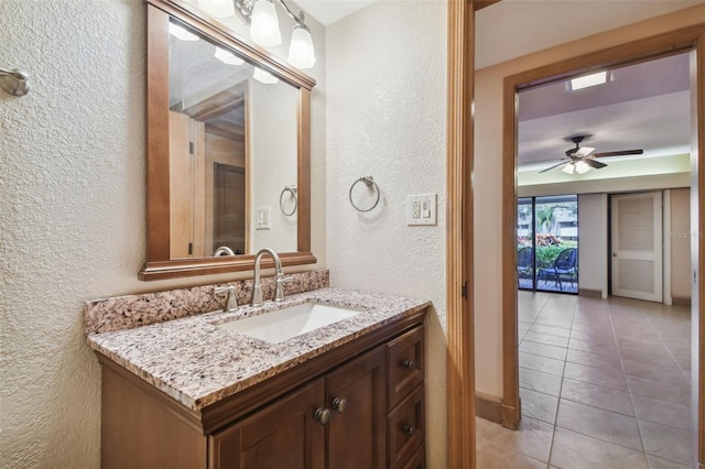 bathroom with vanity, ceiling fan, and tile patterned flooring