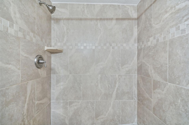 bathroom featuring tiled shower