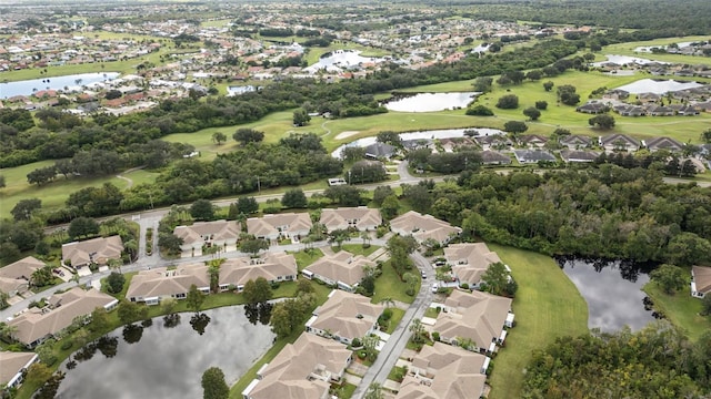 birds eye view of property with a water view, view of golf course, and a residential view