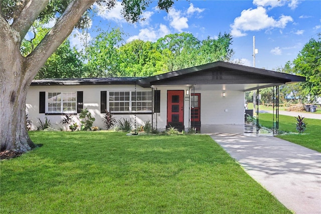 single story home with a front yard and a carport