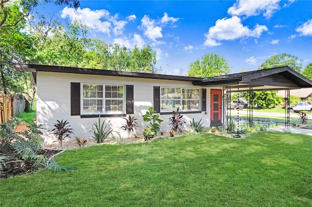 single story home with a carport and a front yard