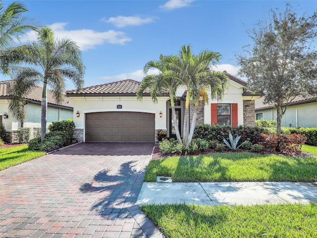 mediterranean / spanish house featuring a garage