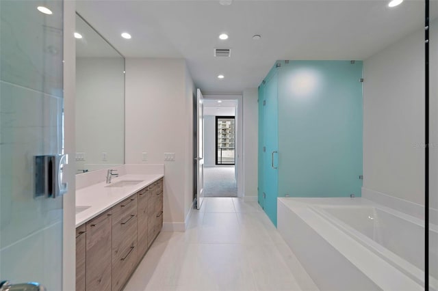 bathroom with tile patterned floors, vanity, and plus walk in shower