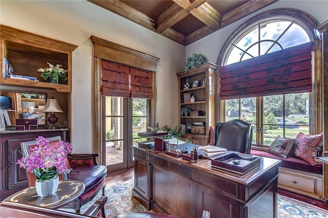 office featuring hardwood / wood-style flooring, coffered ceiling, and a wealth of natural light