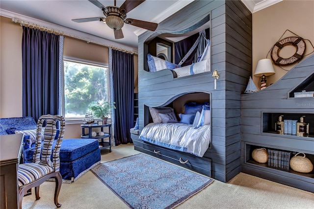 carpeted bedroom featuring ornamental molding and ceiling fan