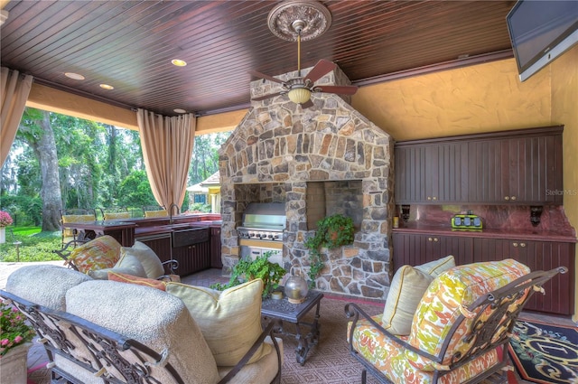 view of patio / terrace featuring an outdoor living space with a fireplace, area for grilling, and ceiling fan