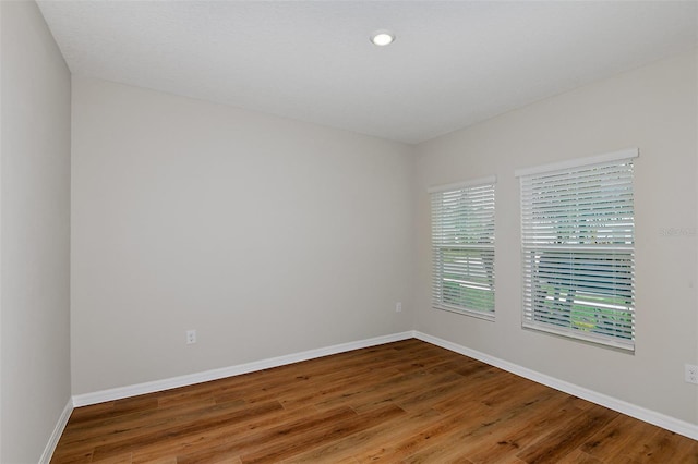 spare room featuring hardwood / wood-style floors