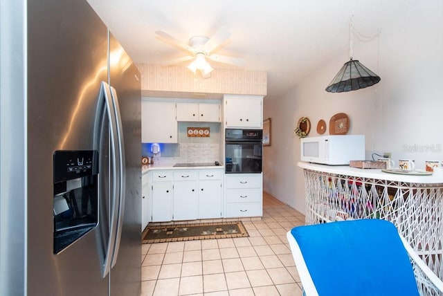 kitchen with decorative backsplash, white cabinets, ceiling fan, black appliances, and pendant lighting