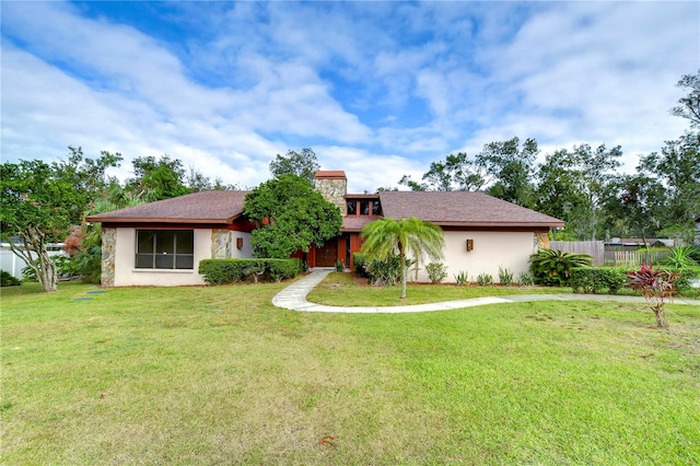 view of front of home with a front lawn