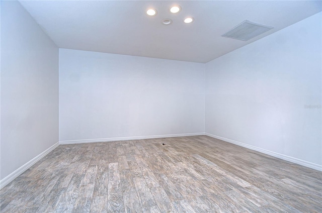 empty room featuring hardwood / wood-style flooring