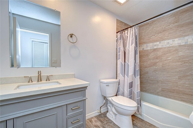 full bathroom featuring shower / tub combo, a textured ceiling, hardwood / wood-style floors, vanity, and toilet