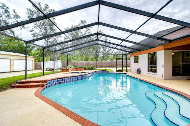 view of pool with glass enclosure, a patio area, an outdoor structure, and an in ground hot tub