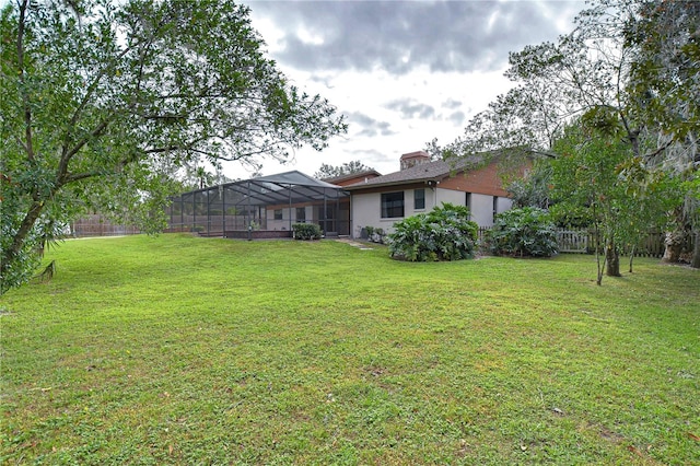 view of yard with a lanai