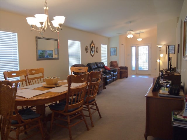 18833 Bent Pine Dr, Hudson, FL 34667 - dining space with carpet, a chandelier, plenty of natural light, and ceiling fan