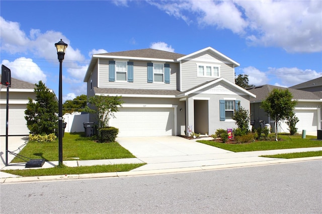 front of property with a garage and a front lawn