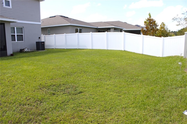 view of yard featuring central AC unit