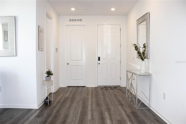 entryway with dark hardwood / wood-style floors