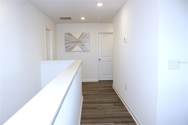 hallway featuring dark hardwood / wood-style floors