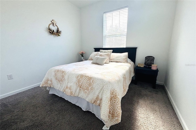 bedroom with dark colored carpet