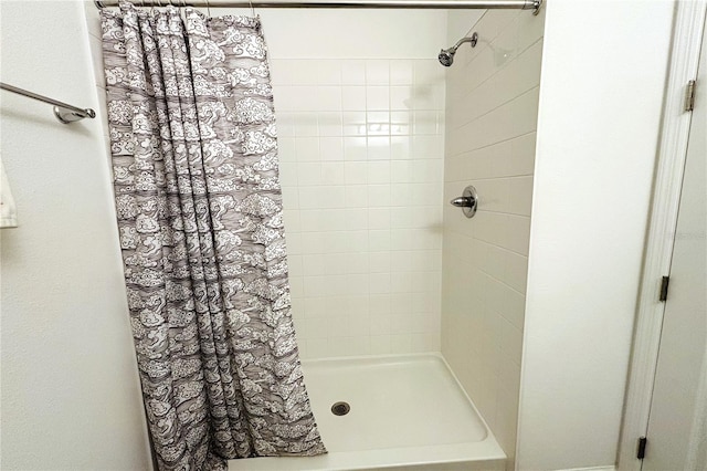 bathroom with a shower with curtain