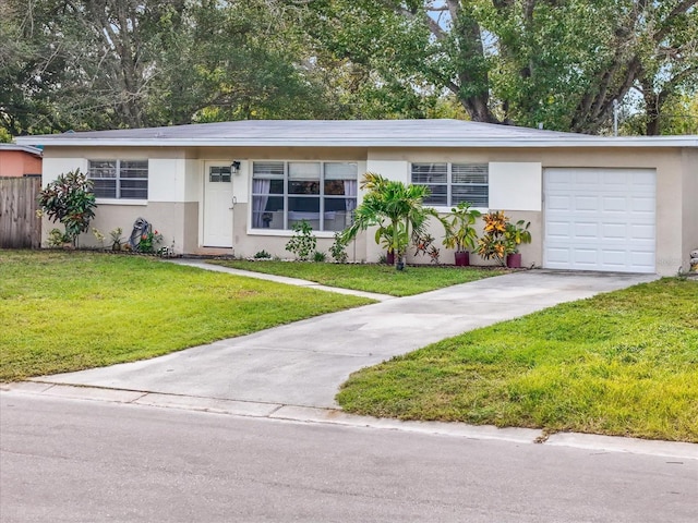 single story home with a front yard and a garage