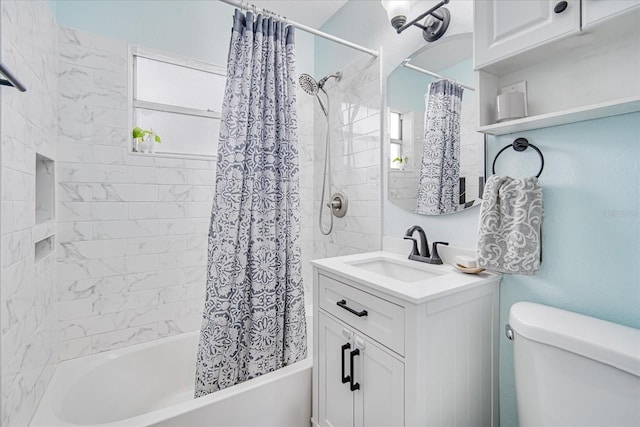 full bathroom with shower / bath combo, vanity, and toilet