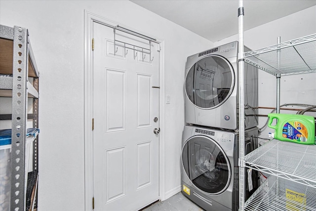 laundry room featuring stacked washer / dryer