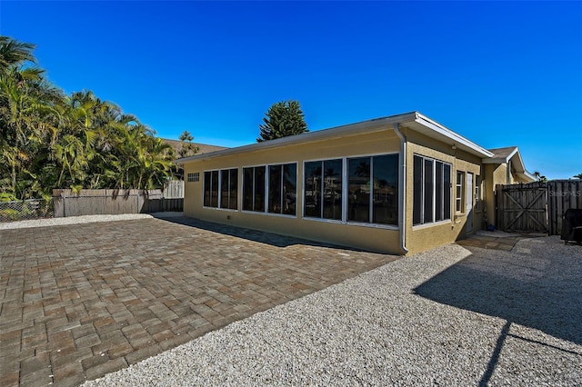 back of house with a patio