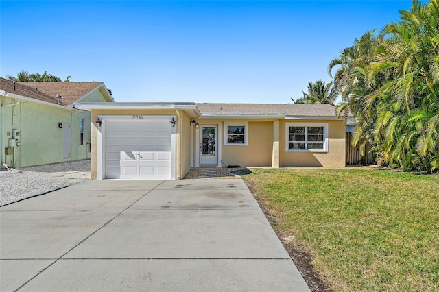 ranch-style home with a front yard and a garage