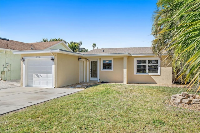 ranch-style home with a front yard and a garage