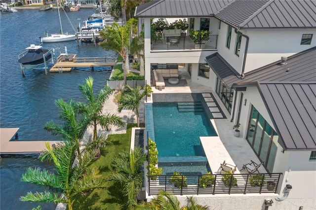 birds eye view of property with a water view