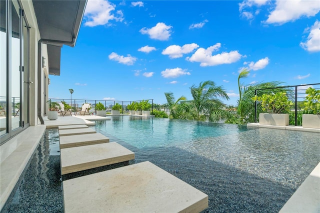 view of swimming pool featuring a patio