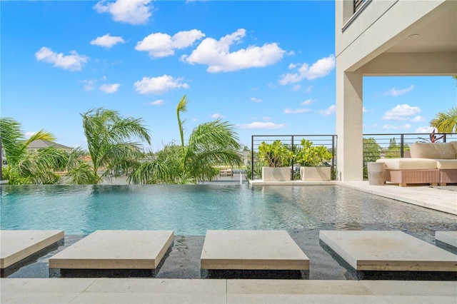 view of swimming pool featuring pool water feature