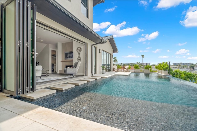 view of swimming pool featuring a patio area