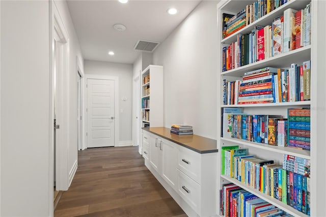 corridor featuring dark hardwood / wood-style floors