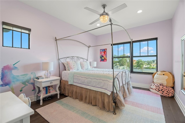 bedroom with ceiling fan and dark wood-type flooring