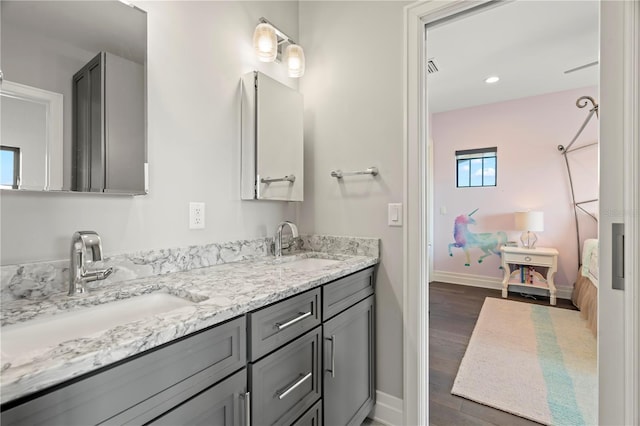 bathroom with vanity and hardwood / wood-style flooring