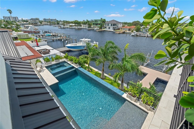 view of pool with a water view