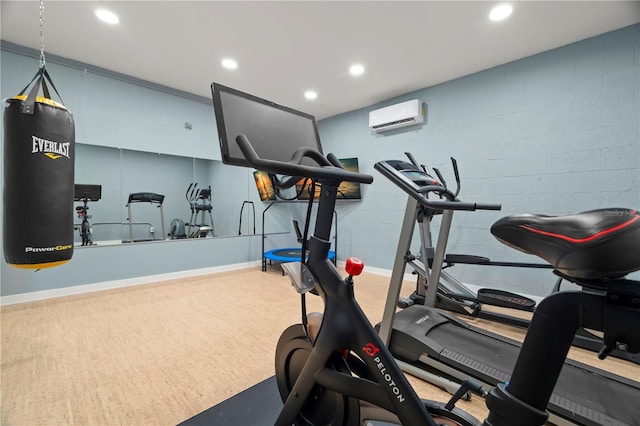 workout area featuring a wall mounted air conditioner