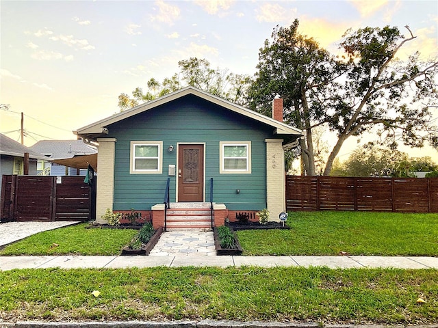 bungalow with a lawn