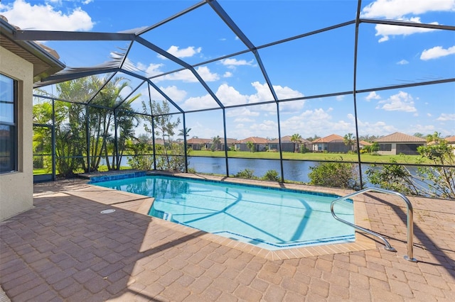 view of pool with a patio, a water view, and a lanai