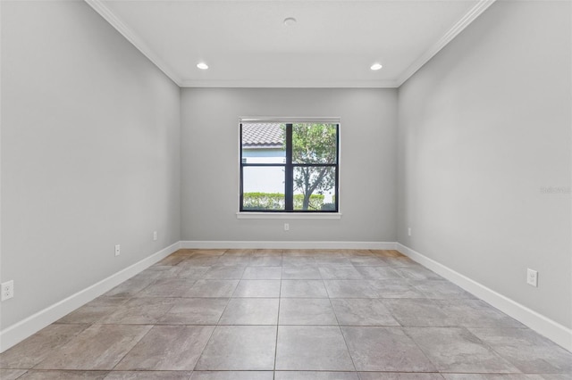 tiled spare room with ornamental molding