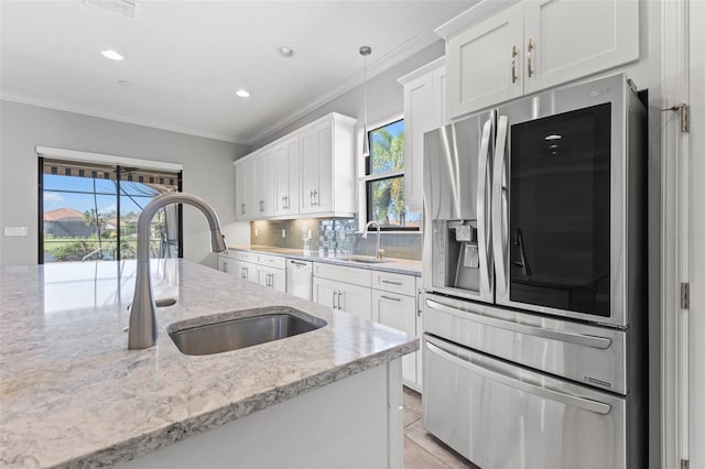 kitchen with hanging light fixtures, smart refrigerator, white cabinetry, white dishwasher, and a sink