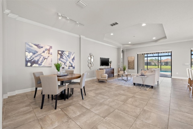 dining space with recessed lighting, visible vents, baseboards, ornamental molding, and a tray ceiling