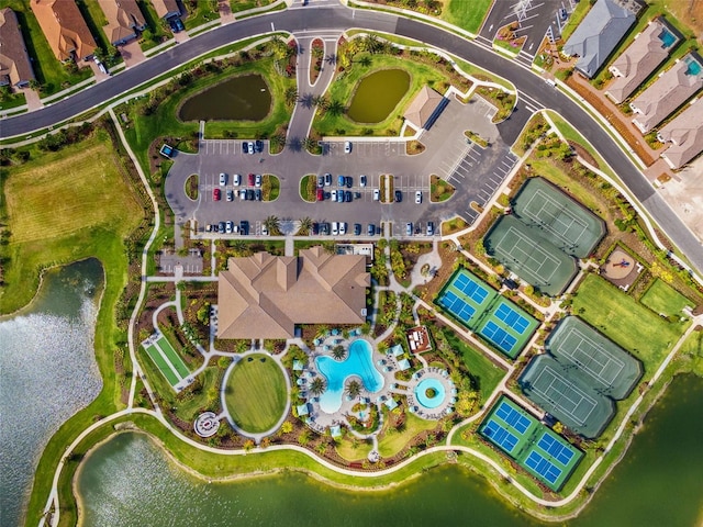 bird's eye view featuring a water view and a residential view