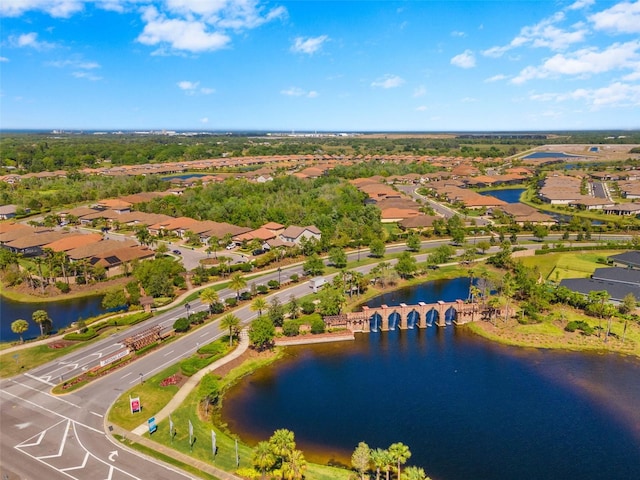 birds eye view of property featuring a water view and a residential view