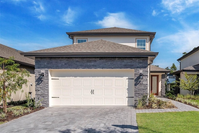 view of front of property with a garage