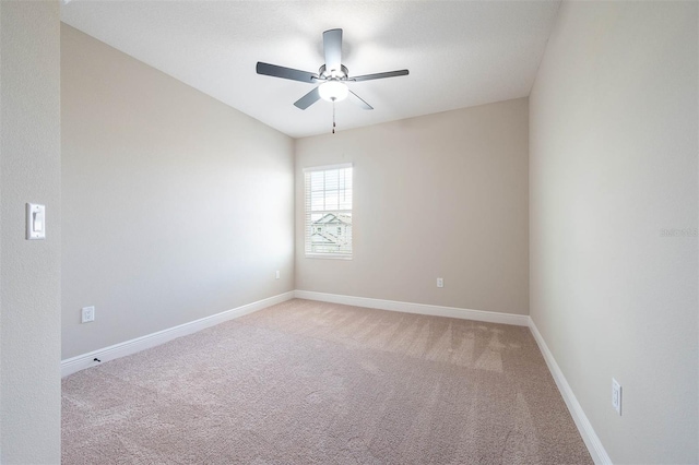 carpeted empty room featuring ceiling fan